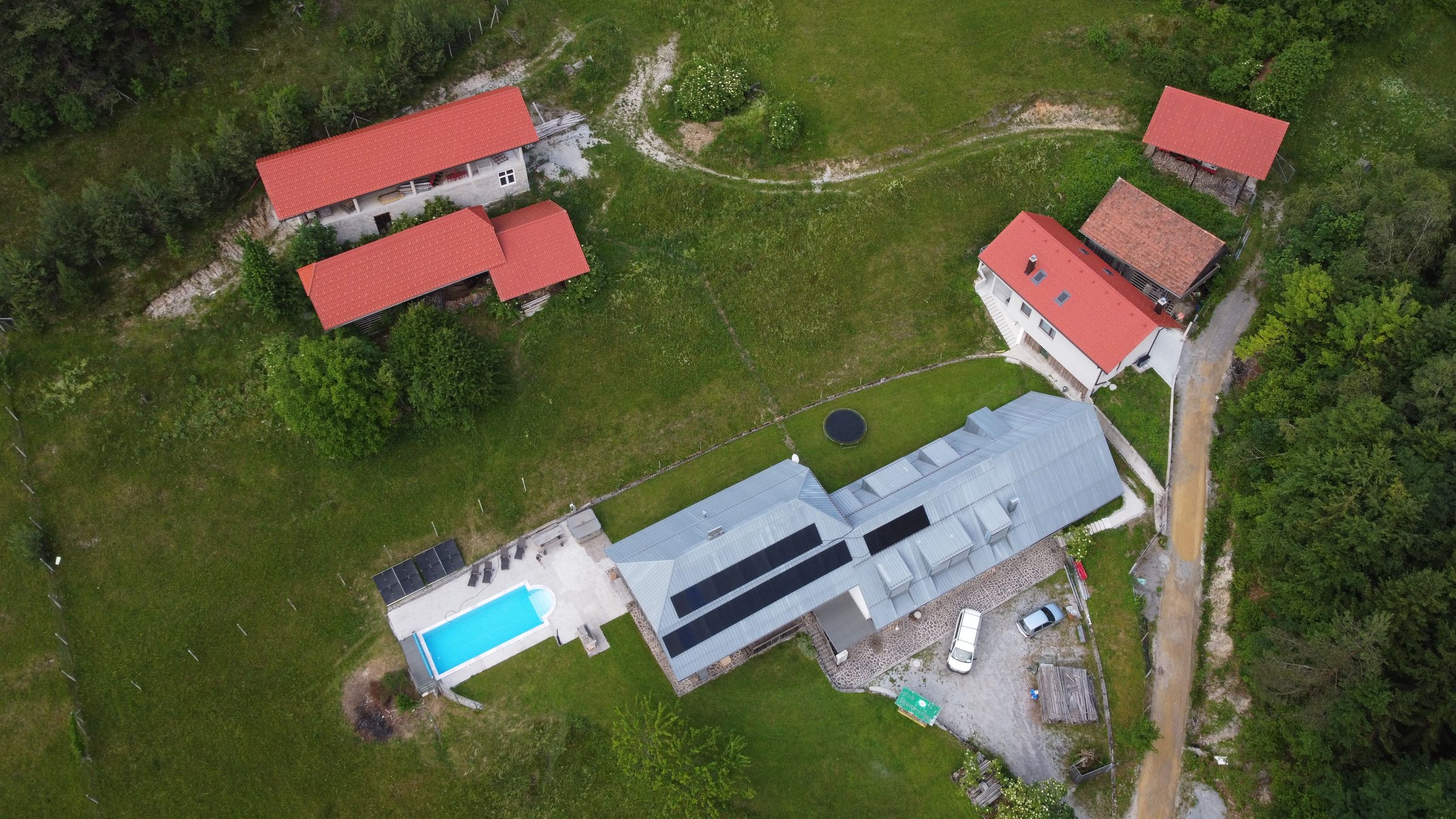 Forest Farmstay from above, surrounded by forest